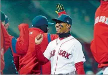  ?? MICHAEL DWYER/AP PHOTO ?? Mookie Betts of the Red Sox celebrates after beating the Yankees 14-1 on Tuesday night at Boston. Betts hit a grand slam.