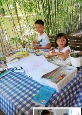  ??  ?? Meeting point: The table in the garden is a favourite place for the family to dine al fresco and for the children to do their projects on a warm day.