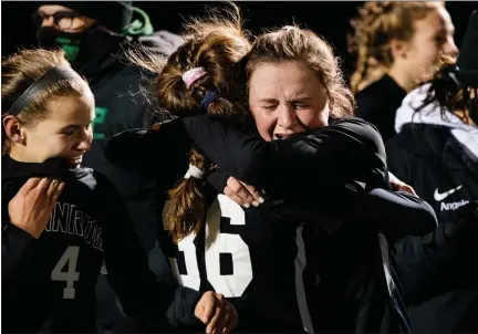  ?? JAMES BEAVER — FOR MEDIANEWS GROUP ?? Pennridge’s Lindsey DeHaven (45) embraces Liv Grenda (36) after the Rams defeated Parkland 4-3in overtime to advance to the state final.