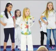  ?? Westside Eagle Observer/MIKE ECKELS ?? Kate Herrera (left), Taryn Moore, Madison Price, Karen Herrera, and Brooklyn Thompson demonstrat­e some of their dance moves during the SPARK program dance and Martial Arts assembly in the cafeteria at Northside Elementary in Decatur Feb. 21.