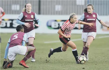  ??  ?? Forward Bridget Galloway tries to pick her way through the Aston Villa defence.