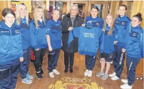  ??  ?? Dundee City Ladies receive tracksuits from Maggie Muir of RBS Muir Plant Hire. The presentati­on was in the Logie Club, another sponsor of the team.