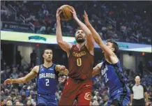  ?? AP file photo ?? Kevin Love (center), a five-time All-Star and 15-year NBA veteran, cleared waivers Monday, then signed a contract to join the Miami Heat for the remainder of the season not long afterward.