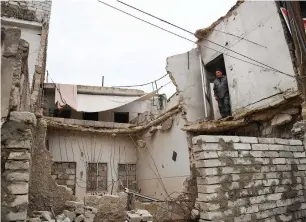  ?? AFP ?? Syrian Khayro Moselmani stands at his destroyed house in the former rebel-held Kalasse neighbourh­ood in the northern Syrian city of Aleppo. —