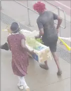  ?? (Pic: Sanele Jele) ?? These supporters were seen carrying a makeshift coffin and illustrati­ng the ‘death’ of Manzini Wanderers supporter Sidumo Ngwenya at the Mavuso Sports Centre.