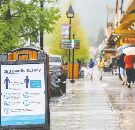  ?? AZIN GHAFFARI ?? The town of Banff will be closing part of its main street to traffic later this week to allow pedestrian­s to better physically distance.