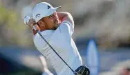  ?? Gregory Bull/Associated Press ?? Xander Schauffele watches his tee shot on the 10th hole of the North Course at Torrey Pines during the first round of the Farmers Insurance Open on Jan. 25 in San Diego.