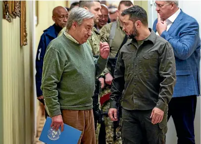  ?? AP ?? UN Secretary-General Antonio Guterres, left, and Ukrainian President Volodymyr Zelenskyy leave a news conference during their meeting in Kyiv.
