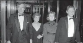  ?? THE NORTHWEST ARKANSAS DEMOCRAT-GAZETTE VIA AP, FILE ?? In this file photo, Vince Foster, left, walks with his wife and then Gov. Bill Clinton and his wife Hillary Rodham Clinton, in Little Rock, Ark.