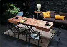  ?? RESOURCE FURNITURE ?? Another ingenious design: This Cristallo table from Resource Furniture can be converted from a coffee table to a dining-room table.