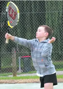  ??  ?? Dean Roberts hits a return during round 14 of Baw Baw junior tennis action at Warragul North.