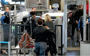  ?? AP ?? Transporta­tion Security Administra­tion officers work at a checkpoint at O’Hare airport in Chicago, yesterday. The TSA acknowledg­ed an increase in the number of its employees calling off work during the partial government shutdown which meant they were not being paid.