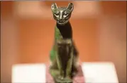  ?? CONTRIBUTE­D BY EMORY PHOTO/VIDEO ?? “Statuette of a Cat,” Third Intermedia­te Period, ca. 1076723 BC, in bronze, is on display at “Divine Felines: Cats of Ancient Egypt” at the Michael C. Carlos Museum through Nov. 11.