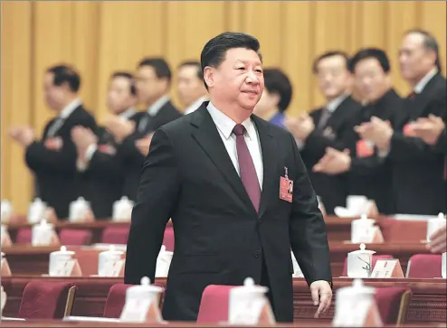  ?? XU JINGXING / CHINA DAILY ?? President Xi Jinping, also general secretary of the Communist Party of China Central Committee, walks into the conference hall during the first session of the 13th National People’s Congress, which opened at the Great Hall of the People in Beijing on...