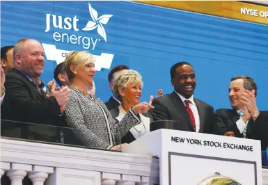  ?? (Brendan McDermid/Reuters) ?? JUST ENERGY Group Inc. executive chairwoman Rebecca MacDonald (center) and co-CEO Deborah Merril ring the opening bell at the New York Stock Exchange yesterday.