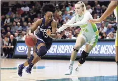  ?? Mike Carlson / Associated Press ?? UConn’s Christyn Williams, left, drives past South Florida's Kristyna Brabencova during the second half on Feb. 16.