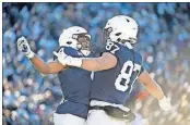  ?? [THE ASSOCIATED PRESS] ?? Penn State running back Journey Brown, left, celebrates with tight end Pat Freiermuth after scoring against Indiana, last week in State College, Pa. Penn State takes on Ohio State this week.