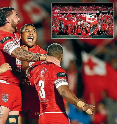  ?? GETTY IMAGES ?? Tevita Pangai Junior celebrates with teammates after scoring for Tonga in front of a massive crowd of supporters (inset) at Mt Smart Stadium.