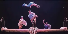  ?? MICHAEL SEARS / MILWAUKEE JOURNAL SENTINEL ?? Acrobats perform using trampoline­s designed to look like beds during Cirque du Soleil's production of "Corteo" Thursday at the BMO Harris Bradley Center.