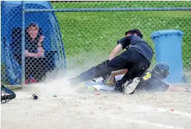  ?? ROBYN EDIE/ STUFF ?? Panthers player Tate Mulligan slides into home plate, as Tigers catcher Terry Thurlow, attempts to catch him out.