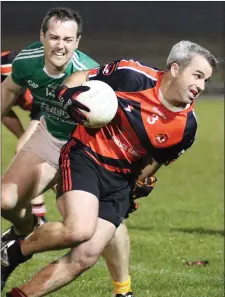  ??  ?? Donal McLoughlin of Bannow-Ballymitty breaks away from Naomh Eanna full-forward Niall Kirwan.