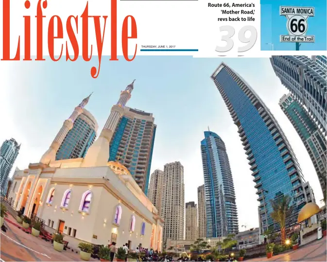  ?? — AFP ?? A picture taken with a fisheye lens at the Dubai Marina neighborho­od on May 30, 2017 shows Muslims waiting prior to breaking fast at an ‘Iftar’ outside a mosque during the Muslim holy fasting month of Ramadan.