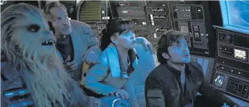  ?? Photo / AP ?? From left: Joonas Suotamo, Woody Harrelson, Emilia Clarke and Alden Ehrenreich in Solo: A Star Wars Story.