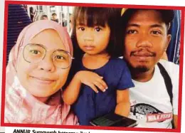  ??  ?? ANNUR Sumayyah bersama ibu bapanya.