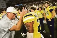  ?? Daniel Varnado / Associated Press ?? Georgia Tech interim head coach Brent Key celebrates with defensive back Clayton Powell-Lee after defeating Duke 23-20 in overtime Saturday at Bobby Dodd Stadium, in Atlanta.