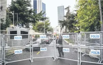  ??  ?? Security members of the Saudi Arabian consulate close police barriers after a diplomatic vehicle arrived at the consulate in Istanbul. — AFP photos