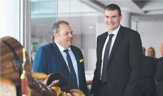  ?? Picture: AAP ?? Retail Food Group boss Andre Nell (right) and chairman Colin Archer at the company’s annual general meeting in Southport yesterday.