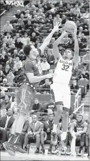  ?? FRED BECKHAM / ASSOCIATED PRESS ?? Connecticu­t’s Shonn Miller, who had 15 point s and four rebounds, shoot s during the first half against Temple in Har tford, Conn., on Tuesday. The Owls won 63-58.