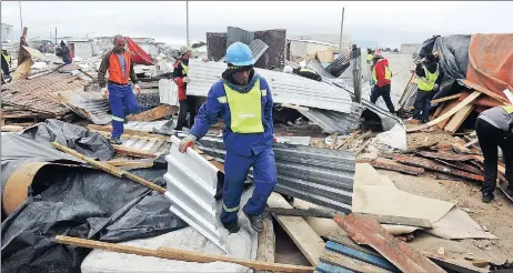  ?? Picture: HENK KRUGER ?? COURT ORDER: Hundreds of residents including children were left homeless after their shacks were demolished in Joe Solvo, Milnerton yesterday.