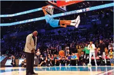  ?? (Reuters) ?? OKLAHOMA CITY THUNDER forward Hamidou Diallo dunks over Shaquille O’Neal in the Slam Dunk Contest during the NBA All-Star Saturday Night in Charlotte.