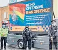  ?? ?? Getting it wrong: Merseyside Police officers with their heavily criticised billboard