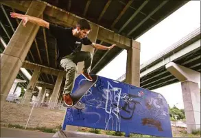  ?? Christian Abraham / Hearst Connecticu­t Media ?? A man practices tricks on his skateboard at the skate park underneath Route 8 in Shelton in 2016.