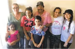  ?? COURTESY PHOTO ?? Daniella Benitez (right) with a family that she helped through Build A Miracle.