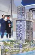  ?? Ahmed Ramzan/Gulf News ?? Visitors look at a scale model of the Palm360 project at Nakheel’s stand yesterday.