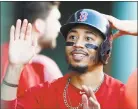  ?? Michael Dwyer / Associated Press ?? The Red Sox’s Mookie Betts celebrates after scoring against the Blue Jays on July 13 in Boston. Betts and Milwaukee’s Christian Yelich were runaway winners of the Most Valuable Player awards after the 26-year-old outfielder­s each led their teams to first-place finishes with dominant seasons that included batting titles.