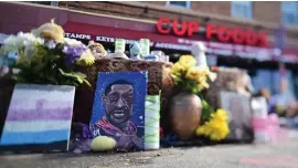  ?? JOHN auTEy / THE sT. PauL PIONEER PREss ?? ‘HE COULDN’T BREATHE’: A shrine to George Floyd is seen Thursday on the spot in Minneapoli­s where Floyd died while in police custody.