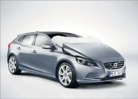  ??  ?? Volvo’s V40 pedestrian airbag raises the bonnet and covers the lower windscreen to protect pedestrian­s in a collision.