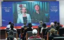  ?? ZHU XINGXIN / CHINA DAILY ?? Maksym Kolosiuk (right), a Ukrainian student at Zhengzhou University in Henan province who was among the first prize winners in the “China and Me, Five Years from Now” storytelli­ng contest, gives a speech via video link at the awards ceremony in Beijing on Monday.