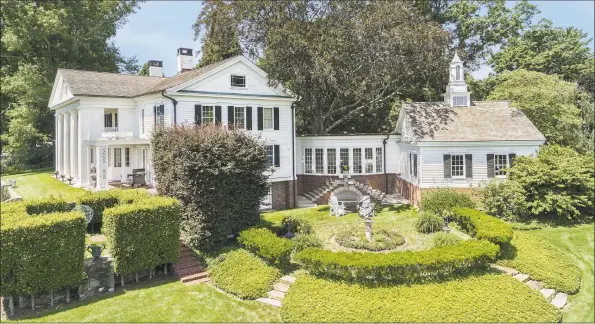  ?? Daniel Milstein Photograph­y / Contribute­d photo ?? The property, with views of Long Island Sound, has interior and exterior entertaini­ng areas, terraces, enchanting formal gardens, pool, a guest house and a stunning party barn.