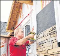  ?? TERRENCE MCEACHERN / THE GUARDIAN ?? Warren Doiron, president of New Homes Plus, has been adjusting his prices this year to account for price increases in lumber and plywood.