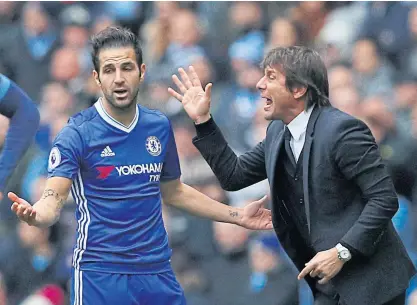  ??  ?? Chelsea manager Antonio Conte and midfielder Cesc Fabregas during the match against Manchester City.