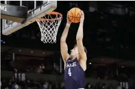  ?? (AP photo/young Kwak) ?? Yale guard John Poulakidas (4) grabs a rebound Friday during the second half of a first-round college basketball game in the NCAA Tournament in Spokane, Wash.