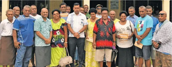  ?? Photo: DEPTFO News ?? Permanent Secretary for Lands and Mineral Resources Malakai Finau (fifth from left), Minister for Lands and Mineral Resources Ashneel Sudhakar (ninth from left) with some of the landowners who received the royalty payout at Nasomo Village in Vatukoula on December 22, 2018.