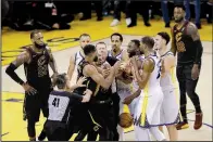  ?? AP/MARCIO JOSE SANCHEZ ?? This scuffle between Cleveland’s Tristan Thompson (second from left) and Golden State Warriors forward Draymond Green at the end of Game 1 of the NBA Finals a part of the tensions that have been building between the two teams who are meeting in the...