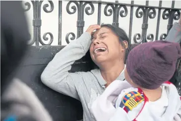  ?? AP ?? A relative of a youth who resided at the Virgin of the Assumption Safe Home wails as she waits for the release of the names of those who died in a fire at the shelter, outside the morgue where the bodies are being identified in Guatemala City on...