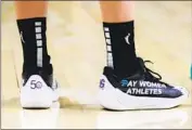  ?? Icon Sportswire Icon Sportswire via Getty Images ?? KATIE LOU SAMUELSON had a simple message on some specially made shoes she wore on the court.